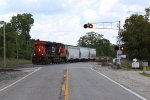 Running long hood forward, 2228 leads three cars west for local industries